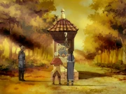 Yong Ten and, Rong Yan look at the kiosk