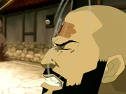 Qian Zei, throws a rock at Shan-Yu's forehead.