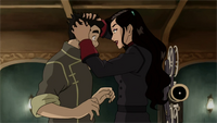 Asami ruffles Bolin's hair