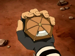 Tijd apparaatje, een zeskantige hand grote schijf met een schaalverdeling in een venstertje.