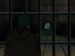 Iroh zit in de gevangenis achter tralies en negeert Zuko volkomen.