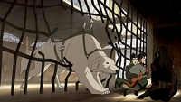 Naga freeing Asami, Bolin, and Iroh