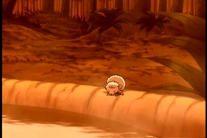 Een klein muisje zit op de rand van het natuurlijke warm water bad van Iroh.