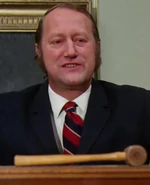 Frank Delfino as Auctioneer