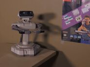 R.O.B. sits in front of a recreation of this room's wall