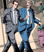 Green and Red in mis-colored Grey and Blue suits, respectively, when Outbreak was republished in color following the release of the novel that details the two executives.