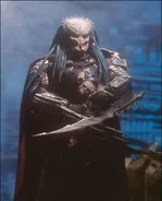 A promotional image for McFarlane's AVP: Alien vs. Predator Ancient Predator figure.