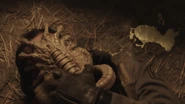 Lopé wrestling with the creature.