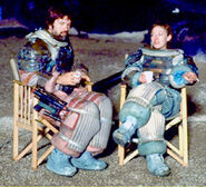 Dallas with his laser pistol holstered in a behind the scenes photo.