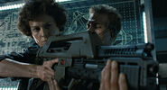 Ellen Ripley holds a Pulse Rifle in Aliens