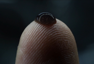 The Weyland Corp logo stencilled on David's fingerprint.