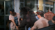 A stuffed black bear being moved into a taxidermy shop as seen in the 1992 film Predator 2.