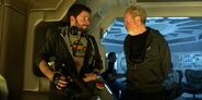 Lauzirika, wearing an Aspen Beer shirt, and Ridley Scott on the set of Prometheus.[2]