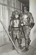 David Smith and Kevin Peter Hall, both in Predator costumes.