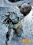 The Yautja holding the bear's severed head as a trophy in Predator versus Wolverine.