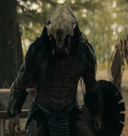 Full body view of the Feral Predator, with his .