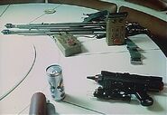 A laser pistol on the table inside the Nostromo.