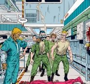 Lying dead on the ground.