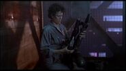 Ripley loading her pulse rifle before her search for Newt.