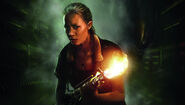 Photograph of Burrows posing as Amanda Ripley, in costume.
