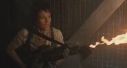 Ripley with lit flamethrower in elevator