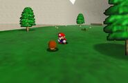 Mario looks at the small goomba.