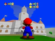 The cloud above the castle has returned, along with mist. The front doors of the castle lead to Demo Lobby.