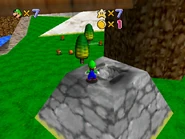 Luigi atop a cannon.