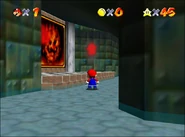 Mario looking arbitrarily at the fire hanging at the wall, near the LLL painting.