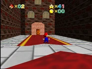 Entrance to Toad's Lobby behind the Toad statue.