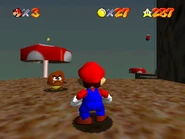 A star floating above a mushroom protruding from the earth.