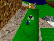 A stern Bob-omb Buddy dutifully guarding it's cannon.