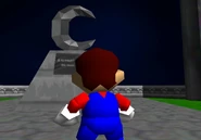 Lunartower1.jpg (121 KB) Mario looks at the moon statue.