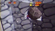 Sneaky Mario squeezing through the boulder.