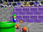 Luigi standing atop the warp pipe to Dry Town, with a ? block containing a star.