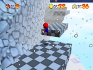 The checkered platforms leading to the item box with the warp.