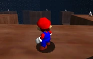 Mario at the bottom part of the cave with platforming.
