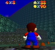 Mario looking up at the mountain.