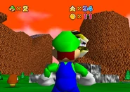 Luigi looking at the golden statue.