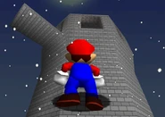 The top of the tower, visible from a floating island. There is a warp pipe on the ledge.