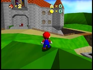 Mario standing in front of the castle.