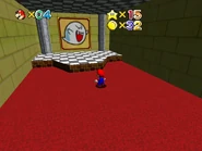 The Boo painting within an enclosed room.