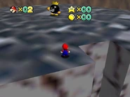 The tallest pillar, with the Big Bob-omb on top of it.