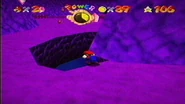 Mario attempting to enter the hole, to no avail.