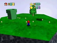 The platform with the pipe leading to Whomp's Prison.