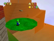 The area with an orange fog.