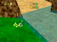 Luigi rides across the area on a Koopa's shell.