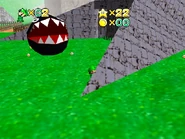 Luigi looks at the Chain Chomp from a not-so-safe distance.