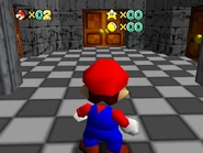 The room at the end of the hall, with doors leading to Bowser's Maze (left), a painting room (middle), and Plexal Basement (right).