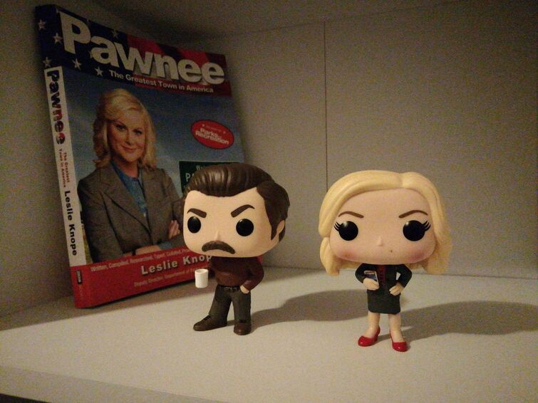 Leslie knope and Ron swanson pop vinyl and pawnee book I got for Christmas